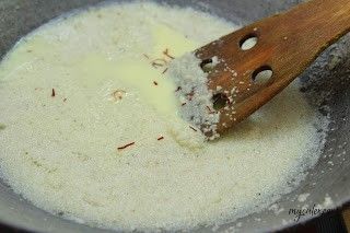 2. Add hot milk-water, soaked saffron and cardamom powder. Mix well.