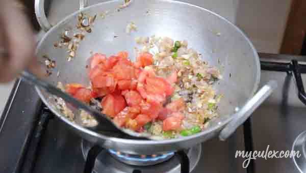 5. Add green and tomatoes. Sauté till soft.