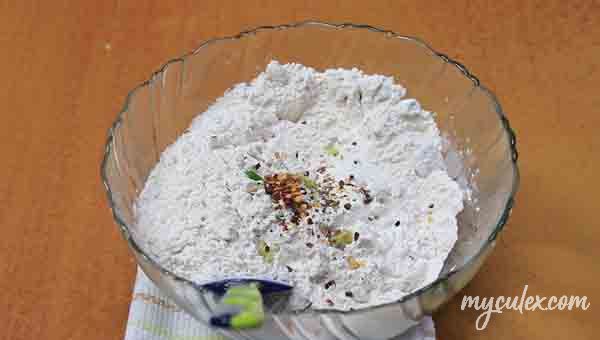 5. In mixing bowl take plain flour and wholewheat flour and salt. Add herbs and chili flakes.
