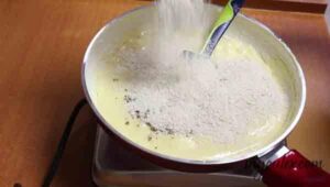 6. Add cardamom powder & sesame seeds.
