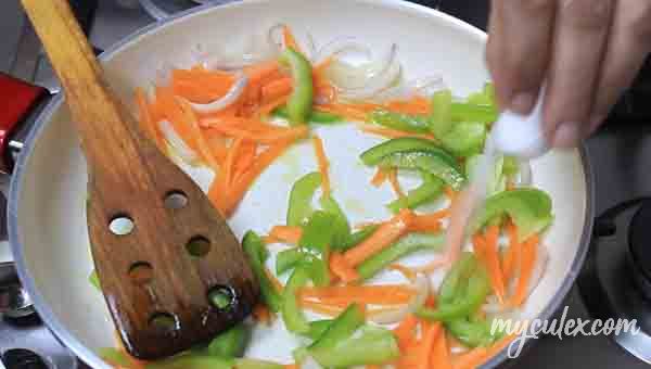 4. Heat oil. Add onions, bell pepper and carrot.