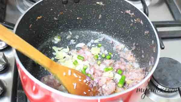 13. When onions turn light brown, add chopped ginger – garlic and green chilies. Sauté