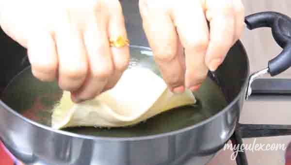 11. Gently side bhatura into oil.
