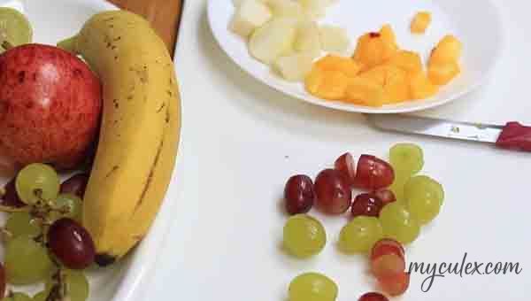2. Slice banana and grapes