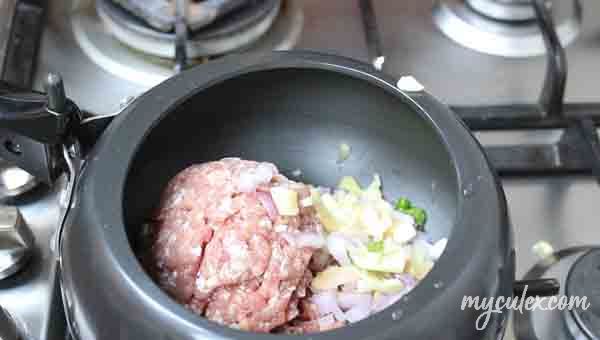 1. In a pressure cooker, place the minced meat with green chili, onion, ginger, garlic.