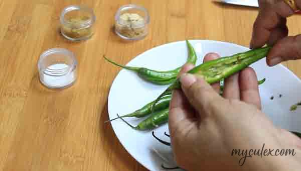 1. Slit open the green chili . Deseed.