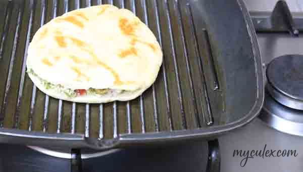 10. Apply cooking spray on grill pan and grill the cheese pita sandwich on one side.