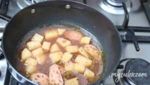 3. Add water to potato bhaji and simmer.