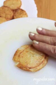 Flatten potato for Aloo Tuk.